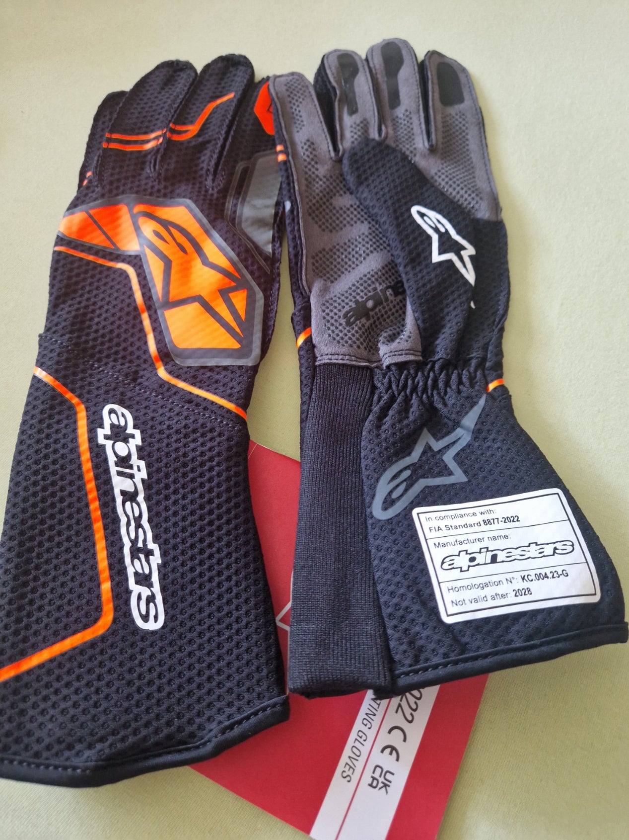Alpinestars Tech-1 KX V4 Handschuhe schwarz/orange fl Homologiert FIA 8877-2022 Größe L